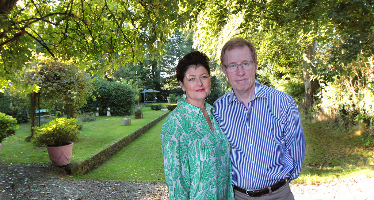 Eugene and Gerardine standing outside underneath trees