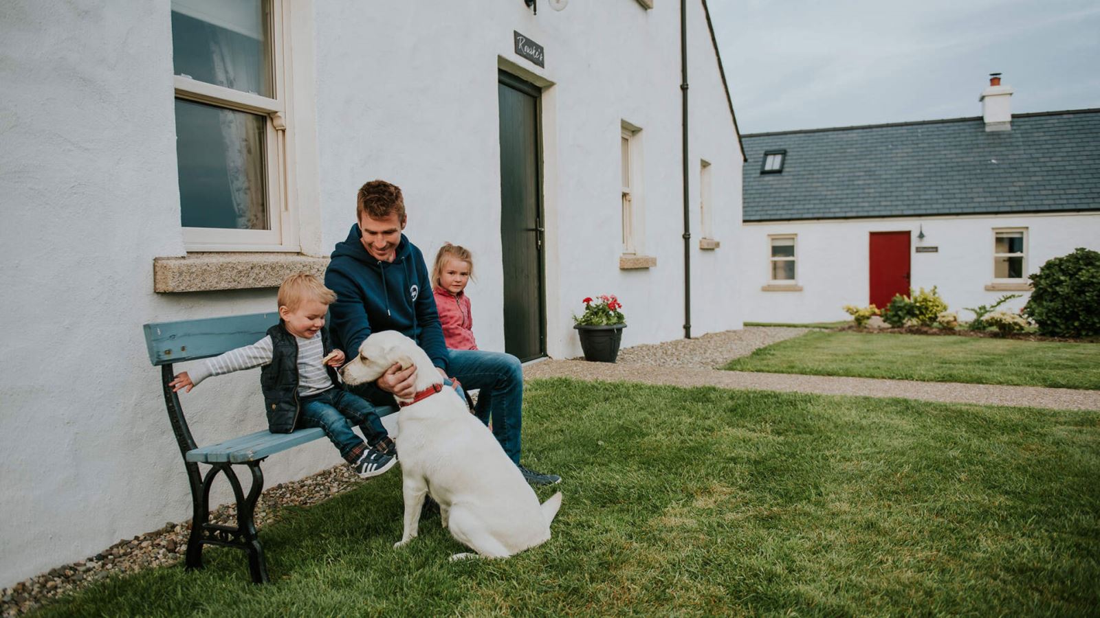 Family with dog at Kribben Cottages